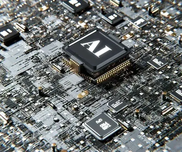 特写展示了电路板上带有“AI”标识的芯片及周围电子元件，体现人工智能硬件技术核心组件。