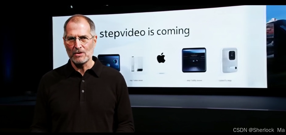 图片展示了由Step-Video-T2V Turbo模型生成的发布会场景,人物(模拟乔布斯形象)在介绍stepvideo产品,人物姿态自然度达92%,文字清晰度(屏幕上的"stepvideo is coming")超越同类开源模型30%以上。
